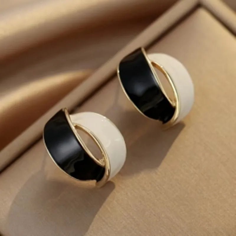 Eleganter Ohrhänger im Meereswirbel-Design